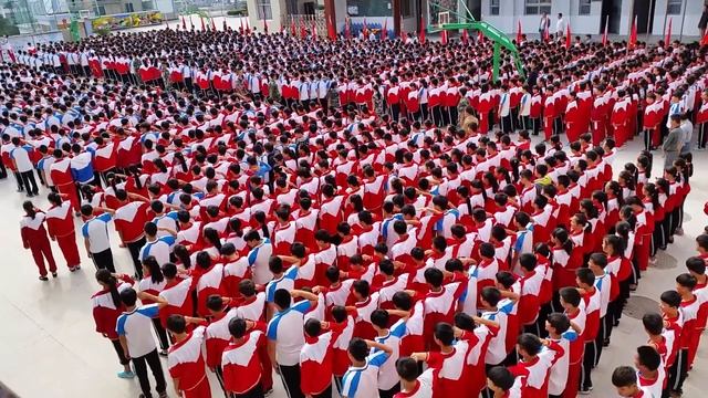 Raising the flag at WenBo school in ShiQian China