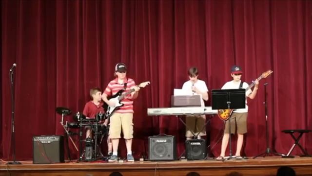 kid tries to play buddy holly riff