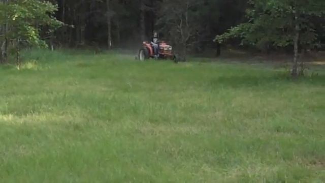 Andrew on the tractor at the farm in New Llano, LA