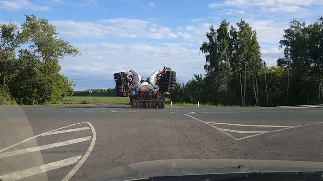 Через Федеральную трассу.