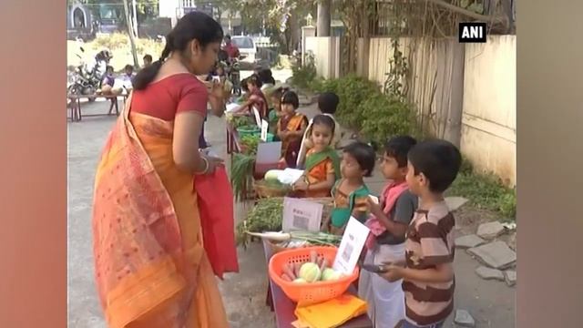 Dressed as vegetable vendors, kids urge people to go digital