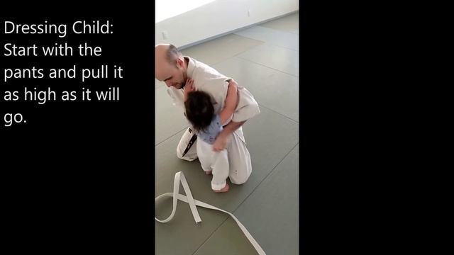 How to put on a gi (karate uniform).