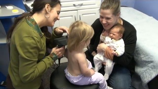 Toddler getting a spinal scan at Van Every Family Chiropractic Center in Royal Oak MI
