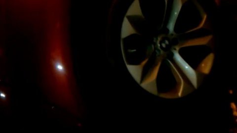 Checking out the Cherry Red Burgandy BMW X6 Suv.