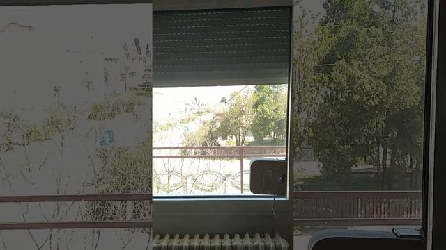 Window cleaner robot ECOVACS Winbot W710 in action.
