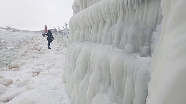 Ice covers iconic Lake Michigan pier and lighthouse