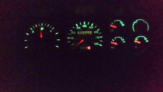 Looking at the 1987 Dodge Dakota instrument cluster at night.