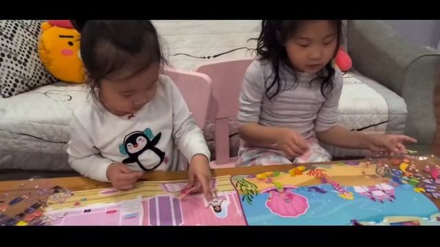 Alena & Serena play with sticker mermaids and dress up girls