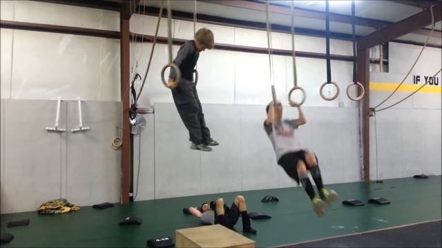 CrossFit Forney Kids doing muscle ups.