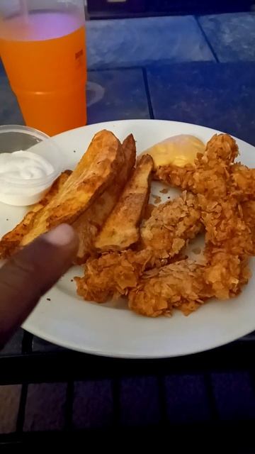 Nashville hot chicken strips with Nashville hot potato wedges