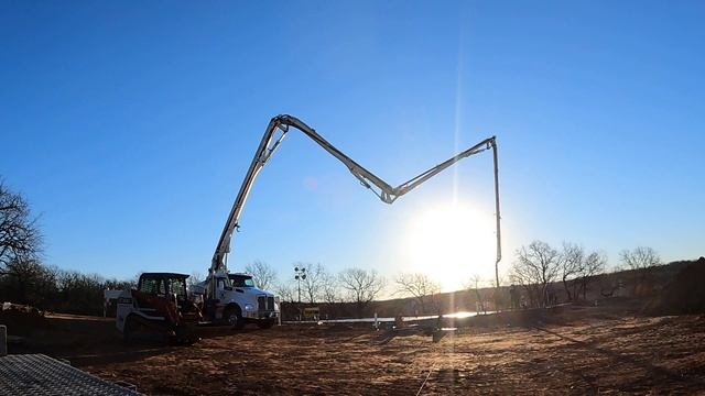 Time lapse of a concrete boom pump. Pumping concrete with Muddyfeet
