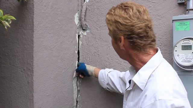 Why do brick chimneys crack next to the stucco walls