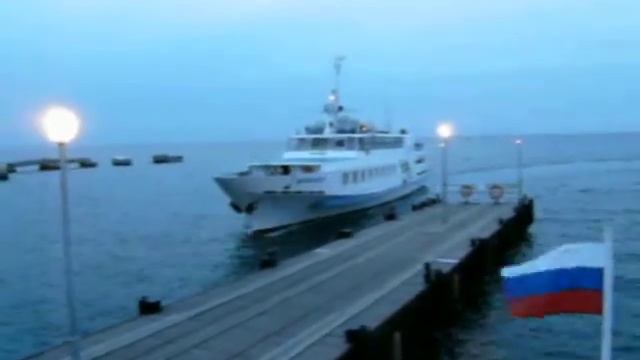 Walk by the ship across evening Anapa