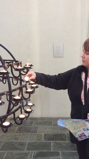 Erika lights a candle @Reykjavik Church