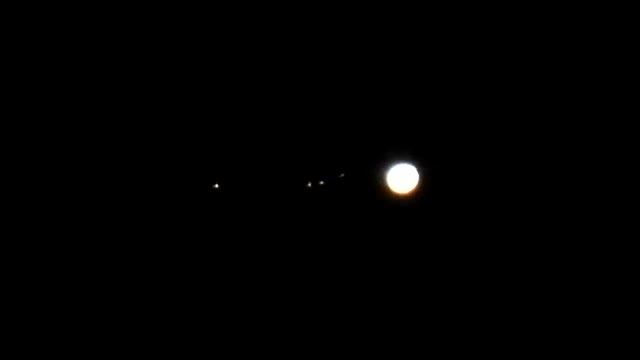 Jupiter with its four largest moons "trailing behind" (filmed with Nikon Coolpix P1000)