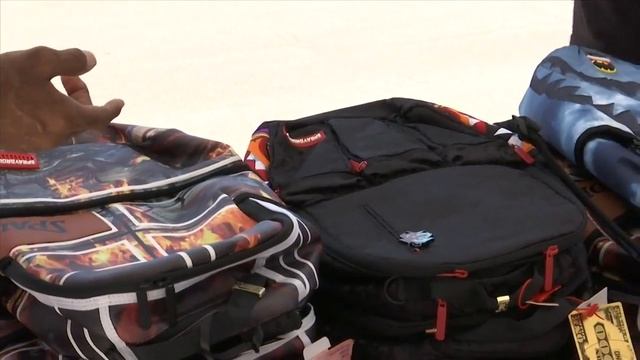 FSU football player Janarius Robinson holds backpack giveaway at Tommy Oliver Stadium