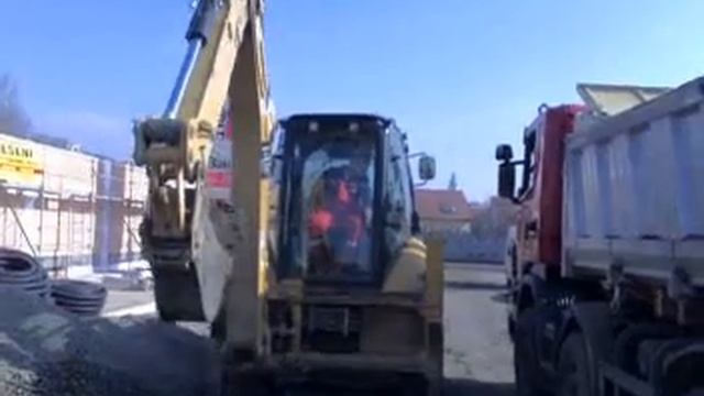 Cat 428E & Scania