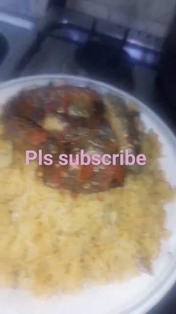 sweet delicious jollof rice and smoked fish