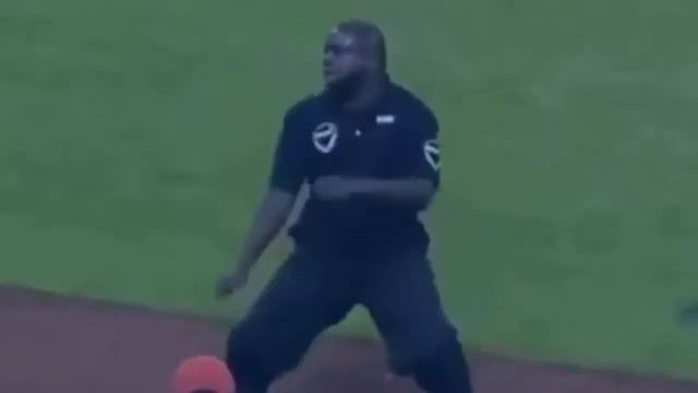 Security Guard shows green fat man how to dance