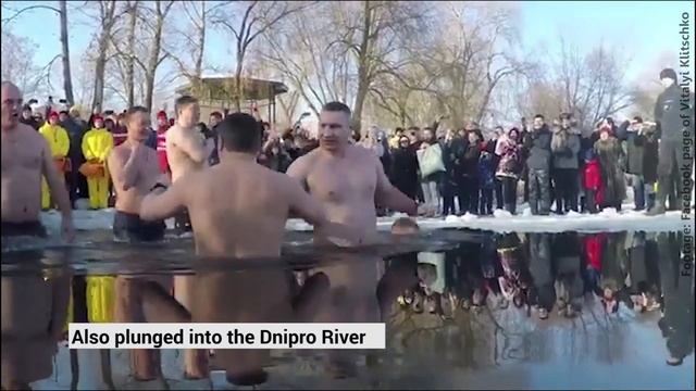 Ukrainians plunge into freezing water to celebrate Epiphany