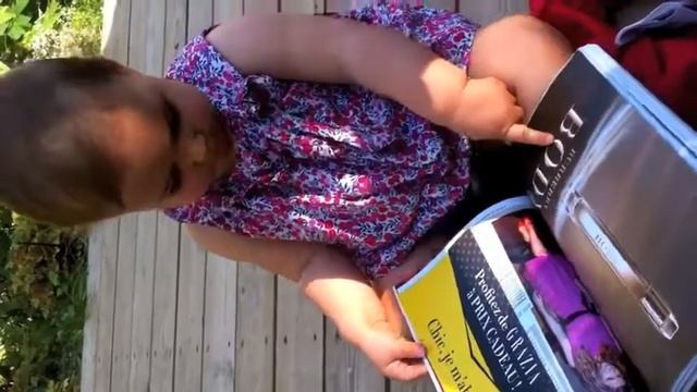 1-Year-Old Plays With Magazine Like It's an iPad [VIDEO].flv