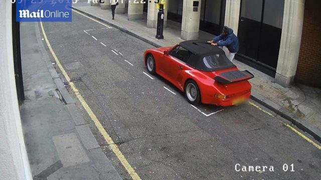 Shocking moment thug slashes into Porsche convertible roof