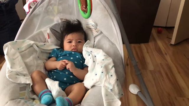 Kiana is trying to grab her toy