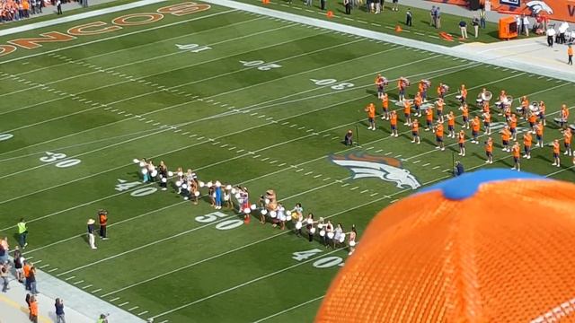 Denver Broncos Cheerleader Turns Into Dancing Dinosaur