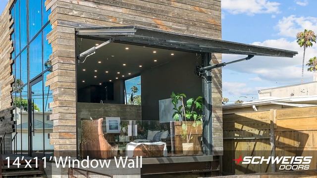 Modern Beach House with a Schweiss Doors Hydraulic Glass Wall
