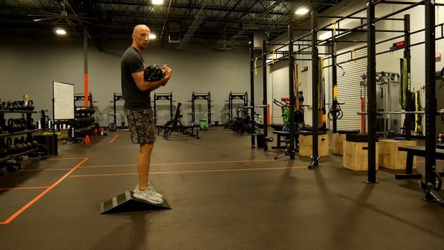 Sandbag Ramp Squat