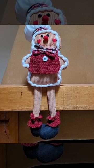 Cute Gingerbread Man sitting on our fireplace mantel