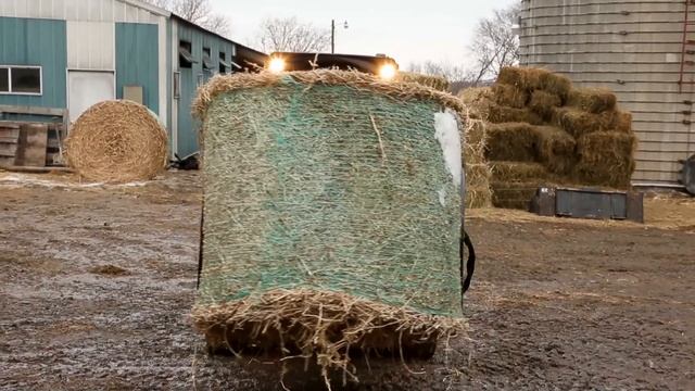 Cat® Bale Grab Attachment at Work