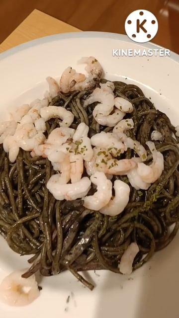 Spaghetti with squid ink sauce and shrimp