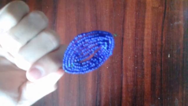 Бисерден күнбағыс ретінде гүл жасау.