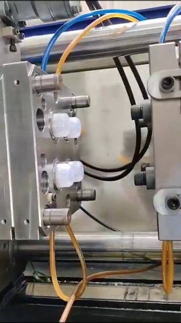 THREEPLAST Injection Molding Machine producing bottle caps [get-save.com]