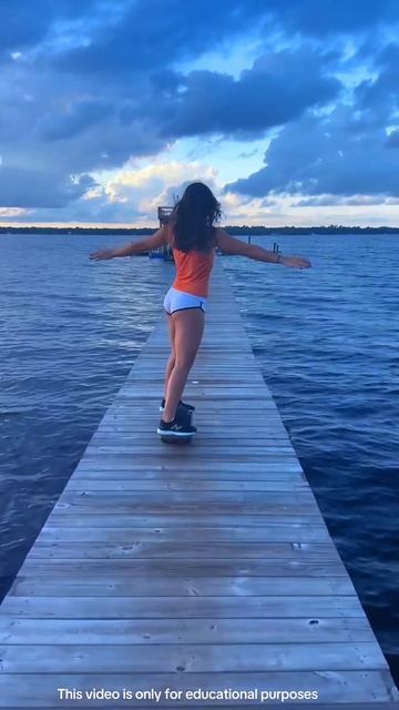girl rode a skateboard on a sea bridge #shortsvideo