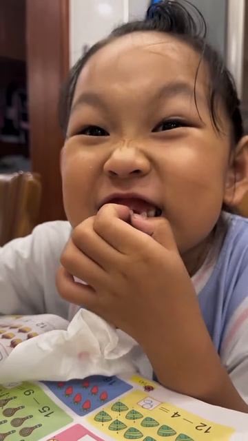 Cute boy removing tooth