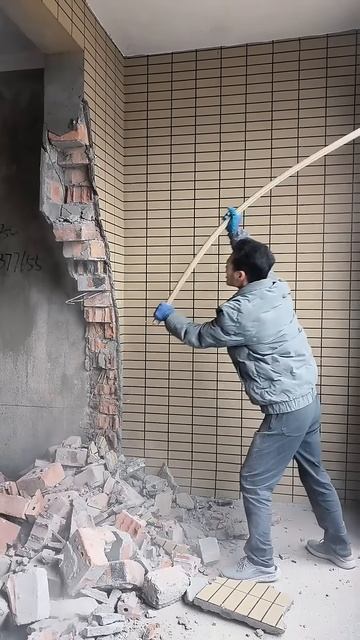 Use the flexible hammer handle to destroy the wall #shorts
