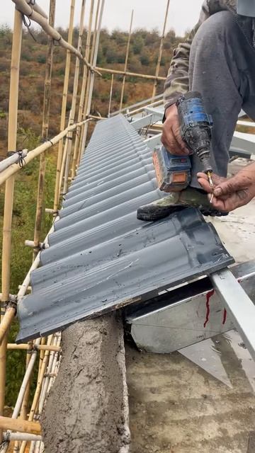 The process of installing roof tiles using a drill #shorts
