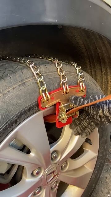 The process of installing a chain on a car tire #shorts