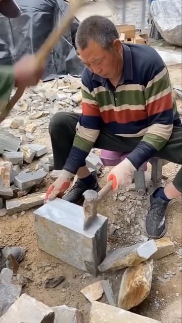 This is the process of splitting a stone using a hammer and chisel #shorts