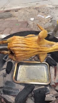 The process of grilling chicken using charcoal #shorts