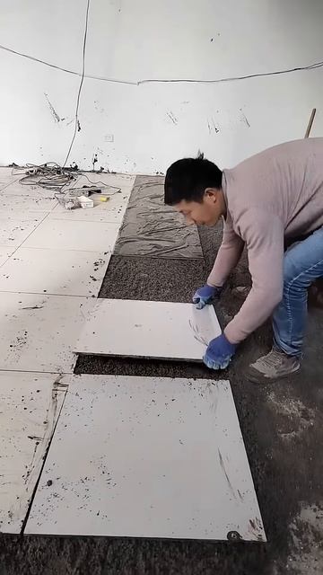 This is a quick process of installing tiles #shorts