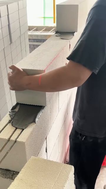 The process of installing bricks to make house walls #shorts