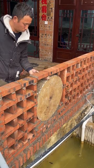 The process of installing bricks to make a pool barrier #shorts