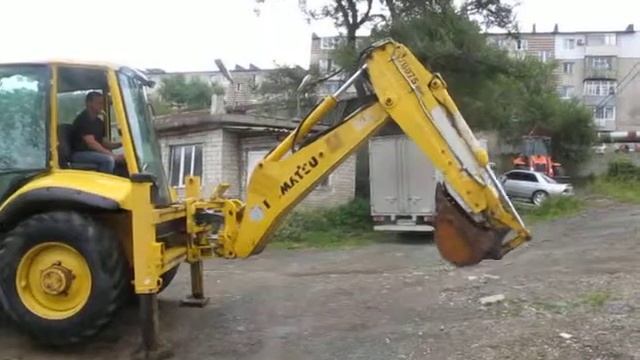 Komatsu WB97S. Auto and Machinery. www.a7m.info