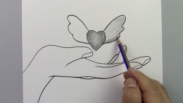 Как нарисовать крылатое сердце над рукой