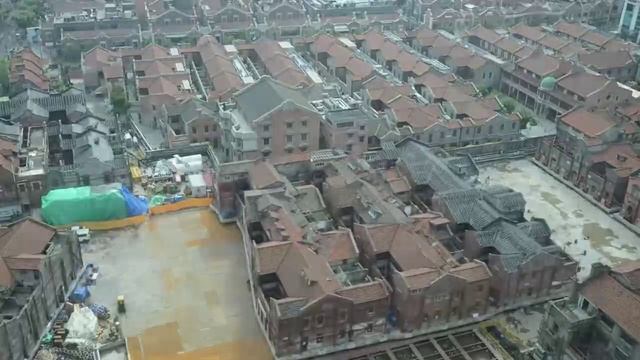 В Шанхае 432 робота перенесли комплекс исторических зданий весом 7 500 тонн, а затем вернули обратно