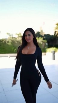DEHA3GeuCyY - Gorgeous model in a black tight jumpsuit: Street style outfit #fashion #style #outfit