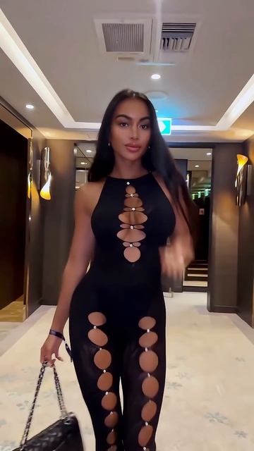 OsD2_hAvymU - Gorgeous model in a black hollow out tight jumpsuit for the night #fashion  #style #ou